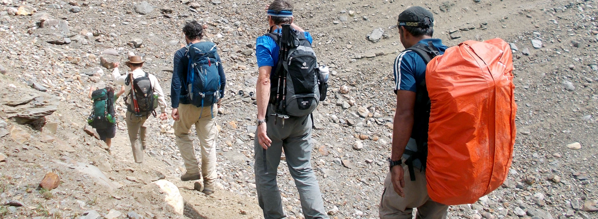 trainee traveling on a route with backpacks on backpacking skills course