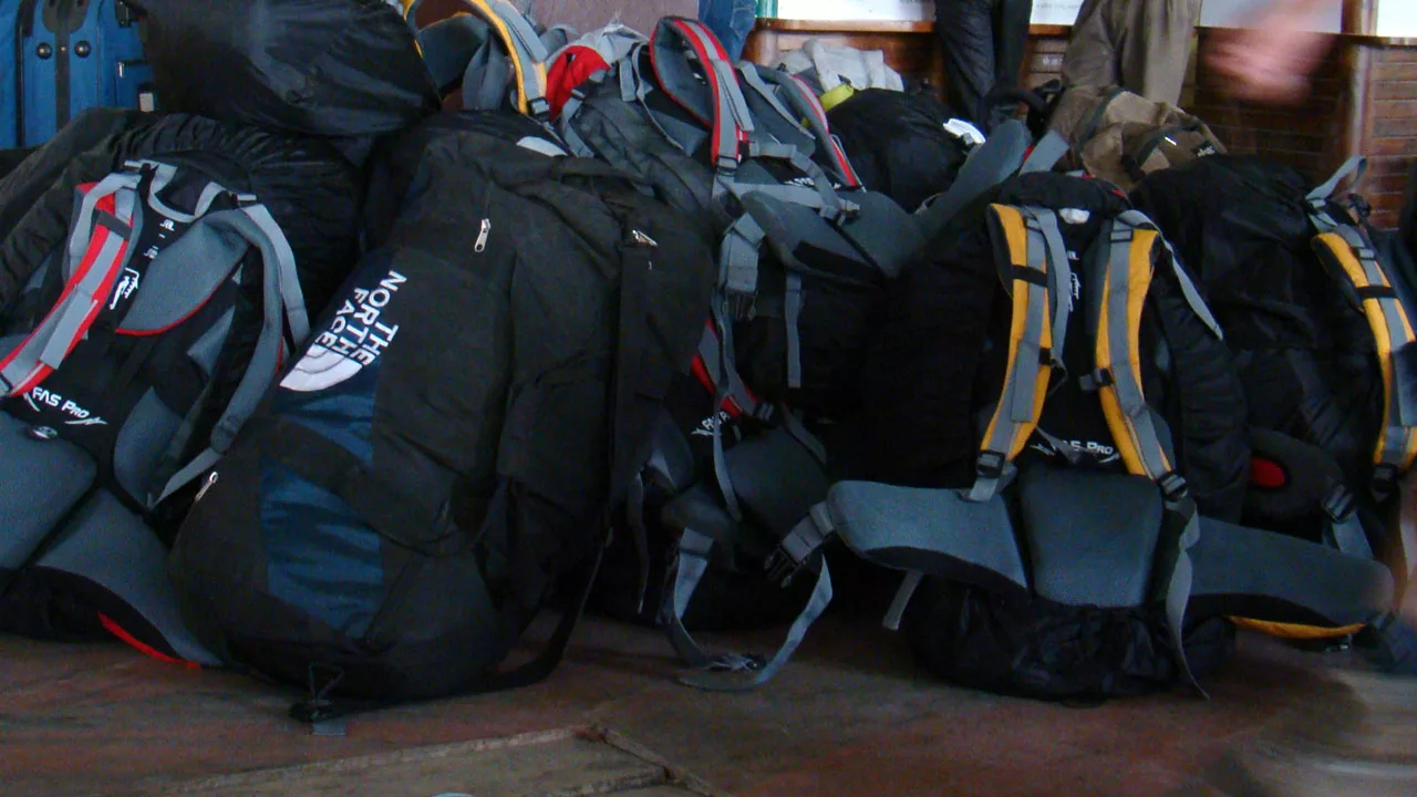 backpacks piled up on the floor