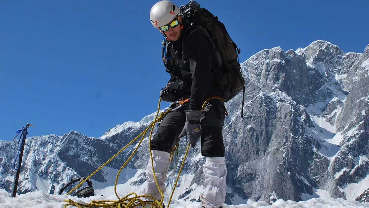 Climber belaying on glacier training 