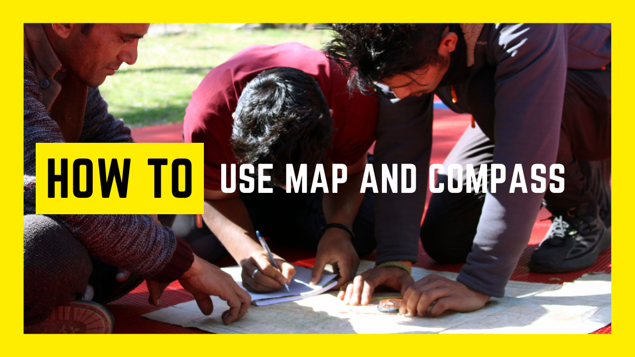 Students plotting a route using a map and compass during mountain guide course image reads how to use map and compass