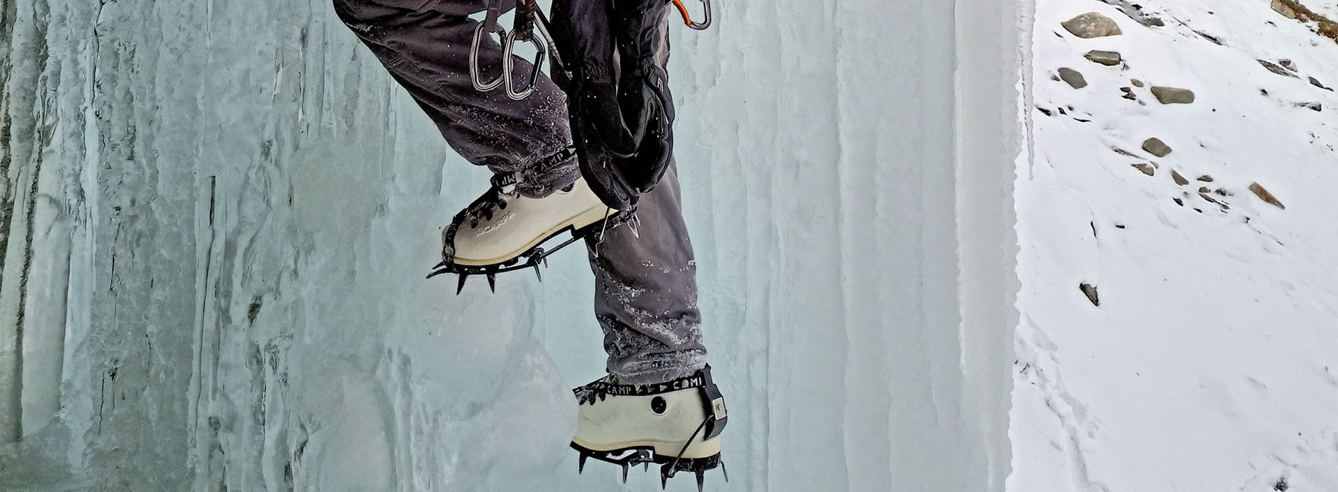 During an ice climbing course, using front-pointing cramponing technique.