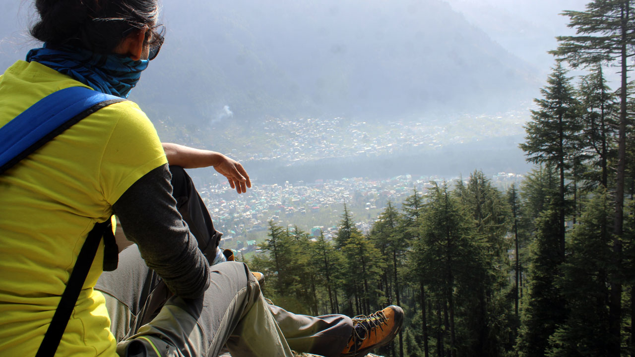 During a trek break, Shashi Tomar Lagwal takes a breather and looks down the Manali panorama