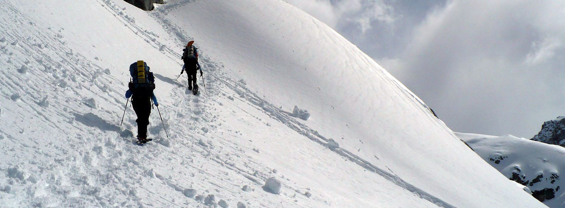 During a snow climbing training, trainees traverses a snowy mountain slope.