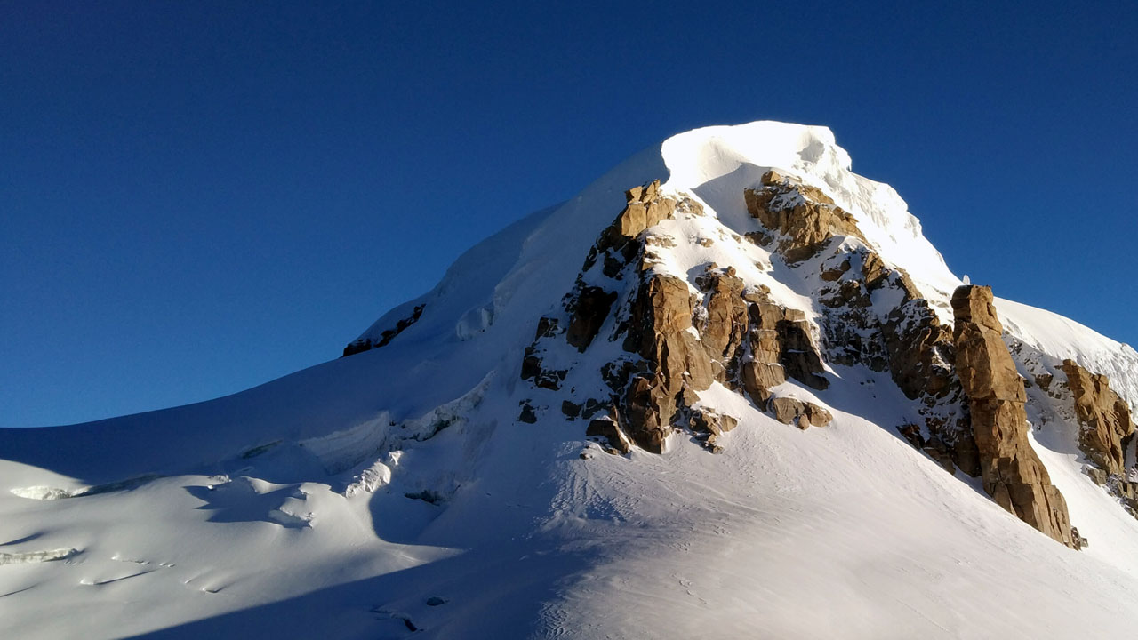 Deo Tibba Peak with its cornice and golden rock spires