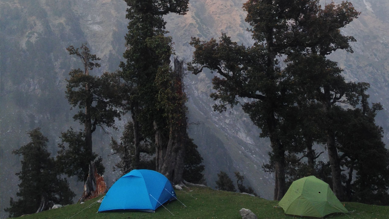 two tents blue and green at ilaqua got campsite on Indrahar Pass Trek