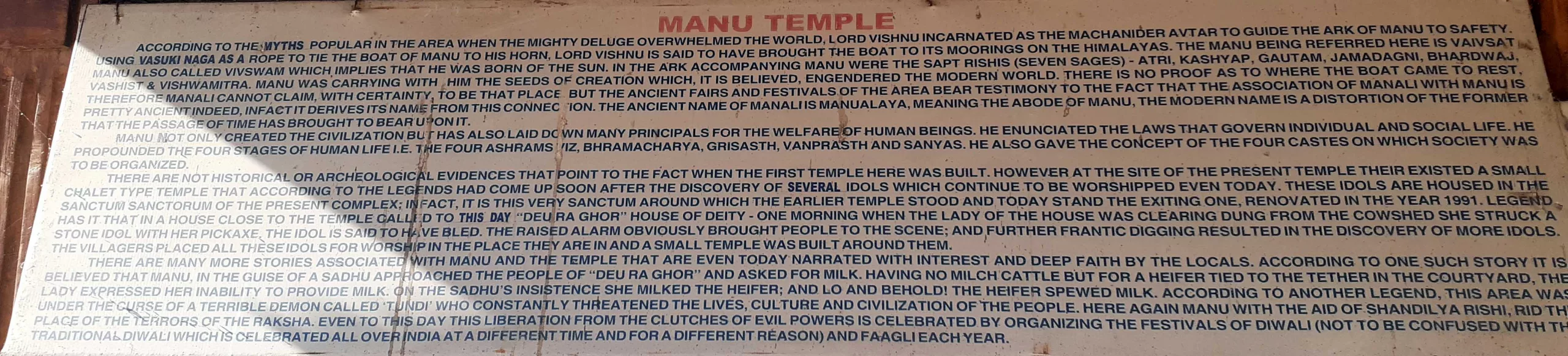 Manu Temple placard informs about the temple's features and history.