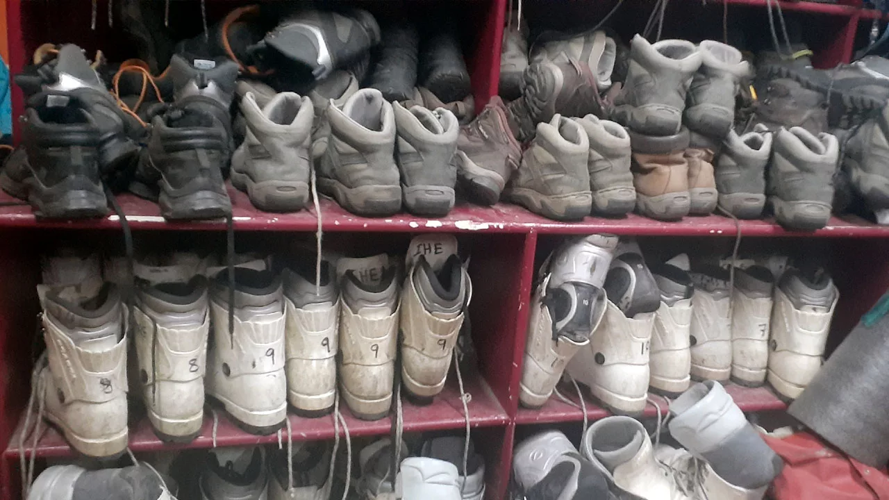  a stack of mountaineering boots available for hire in manali