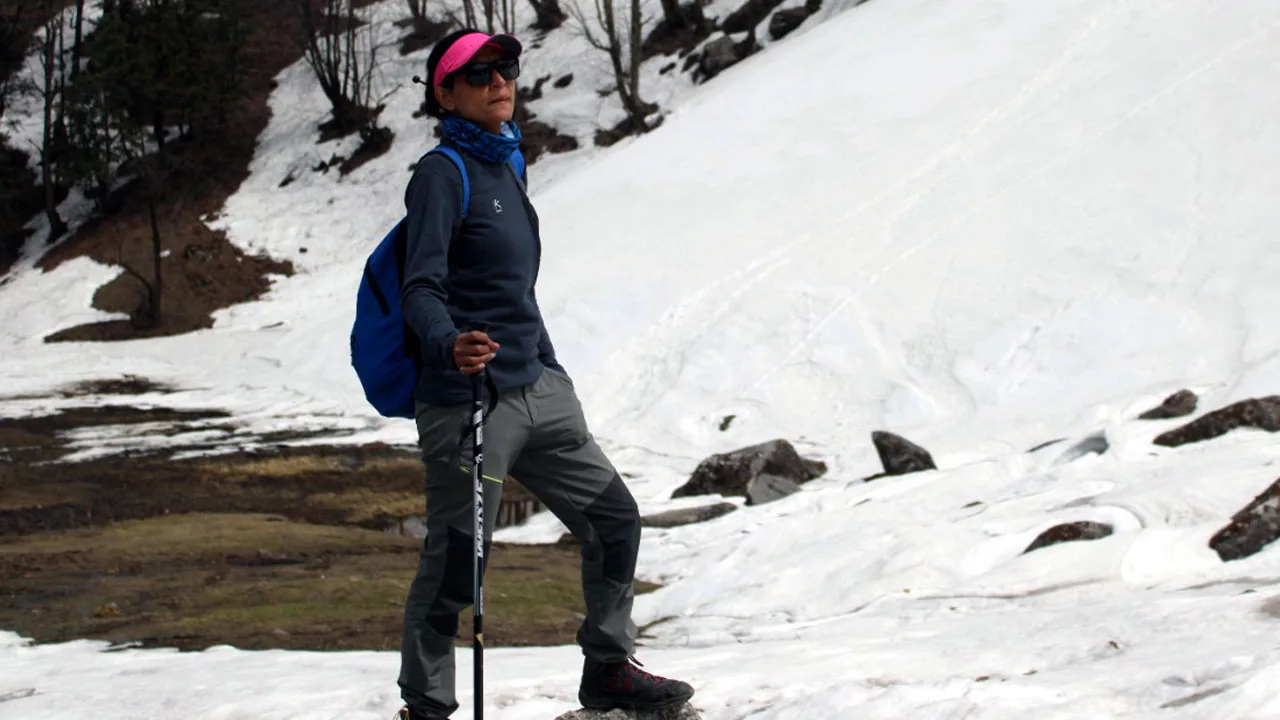 Shashi Lagwal, a mountain guide, stands with her eye on the peak of Hanuman Tibba.