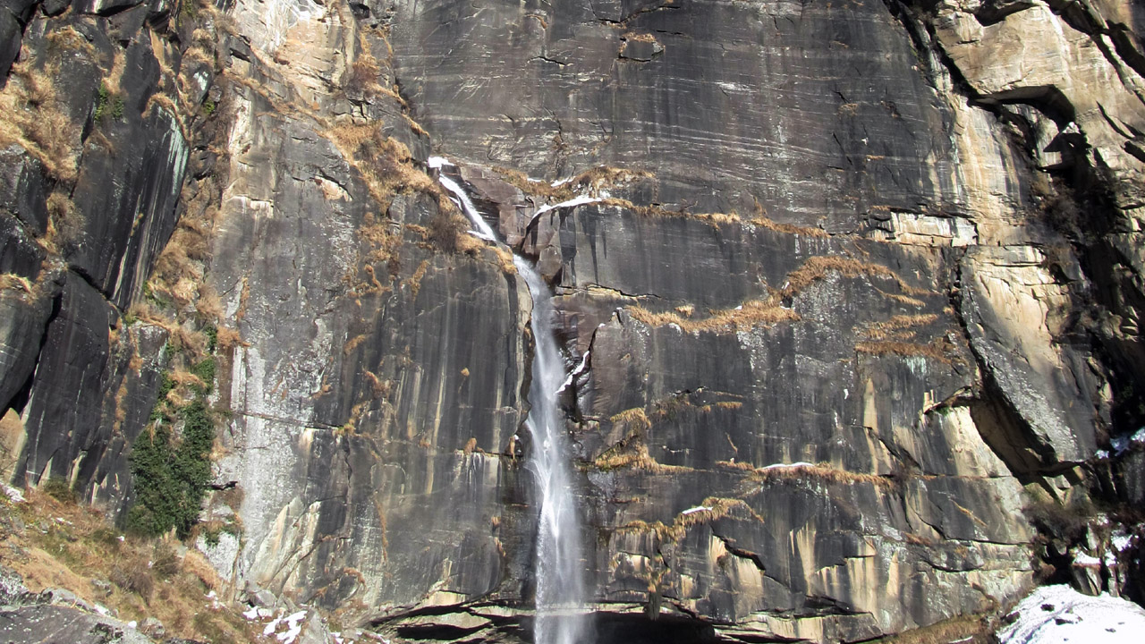 Jogini waterfall runs down the cliff on a short hike near Manali