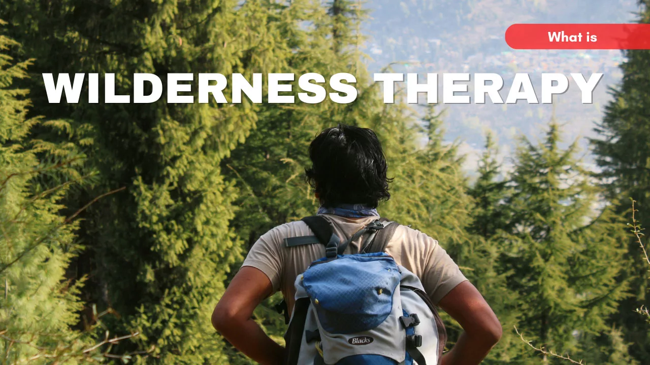 Surender Mahant, wearing a backpack, stands in a pine forest. Poster reads what is Wilderness Therapy