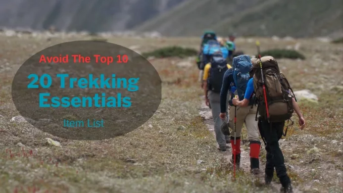 Clients travelling in a line with bags on their shoulders and walking sticks banner reads 20 Trekking Essentials Item List