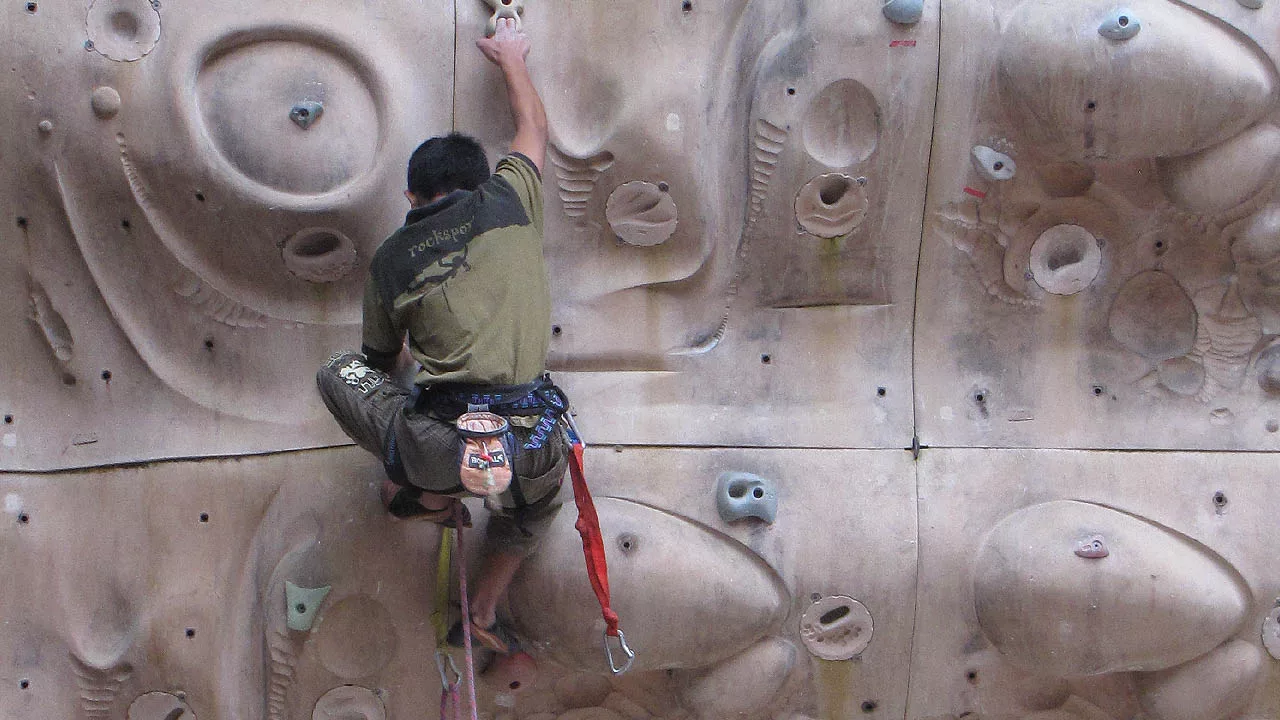 Climbing on Artificial Rock Climbing Wall 