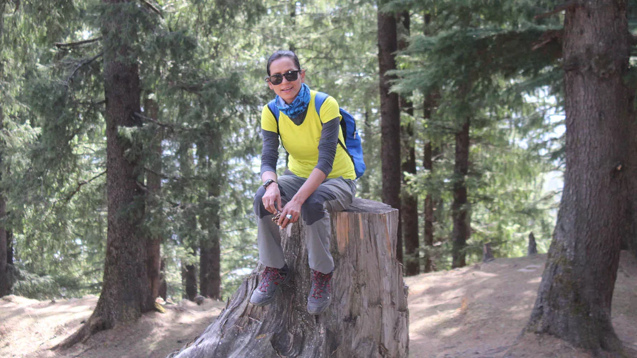 Shashi Lagwal sitting on choped Tree trunk