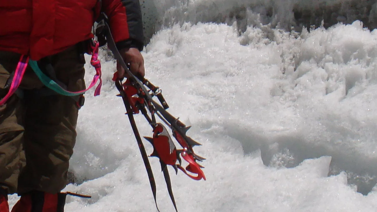 Crampons in Hand of a climber