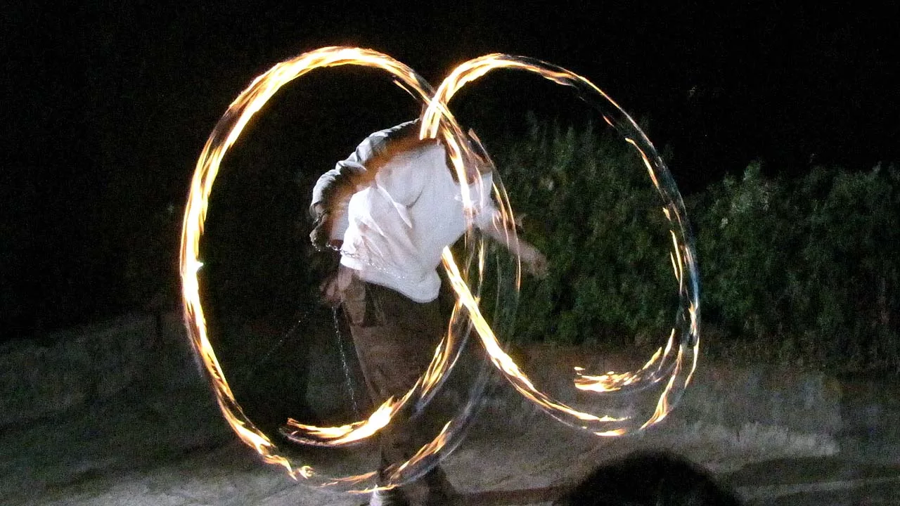 Person playing fire poi
