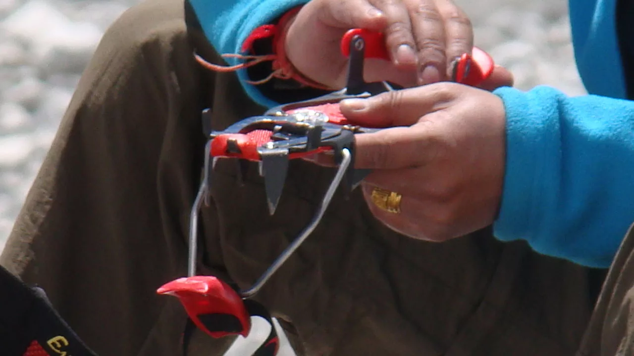 Client adjusting his crampons 