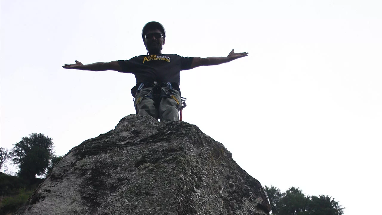 Climber on top of rock Aleo Manali HP