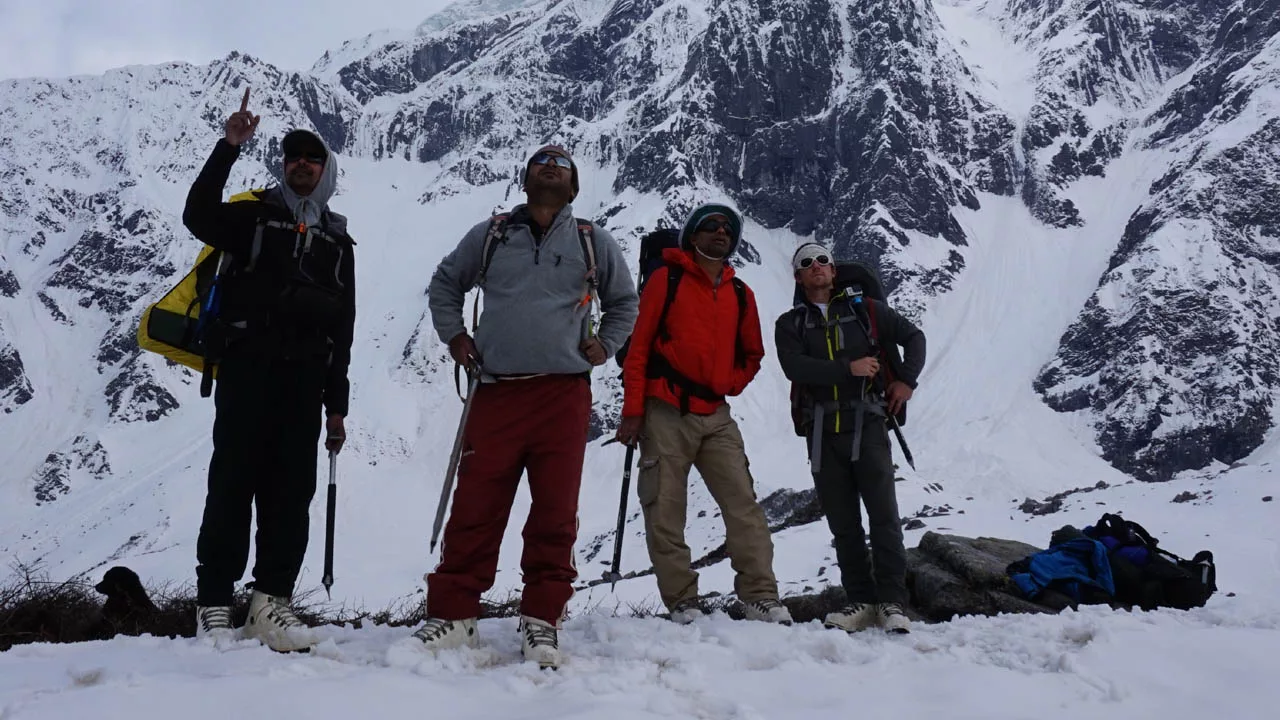 group of trekkers pointing to the right route