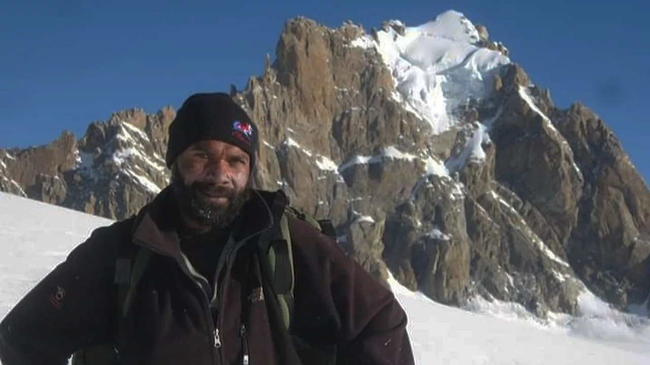 Umesh Raina on Deo Tibba Glacier in the Pir Panjal Range, with Indrasan Peak in the background