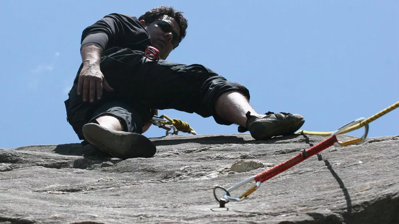 Lead climber on Belay with quick draw