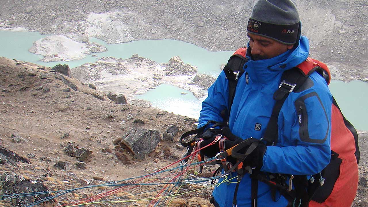 Col. Rana prepares his paraglider for flight