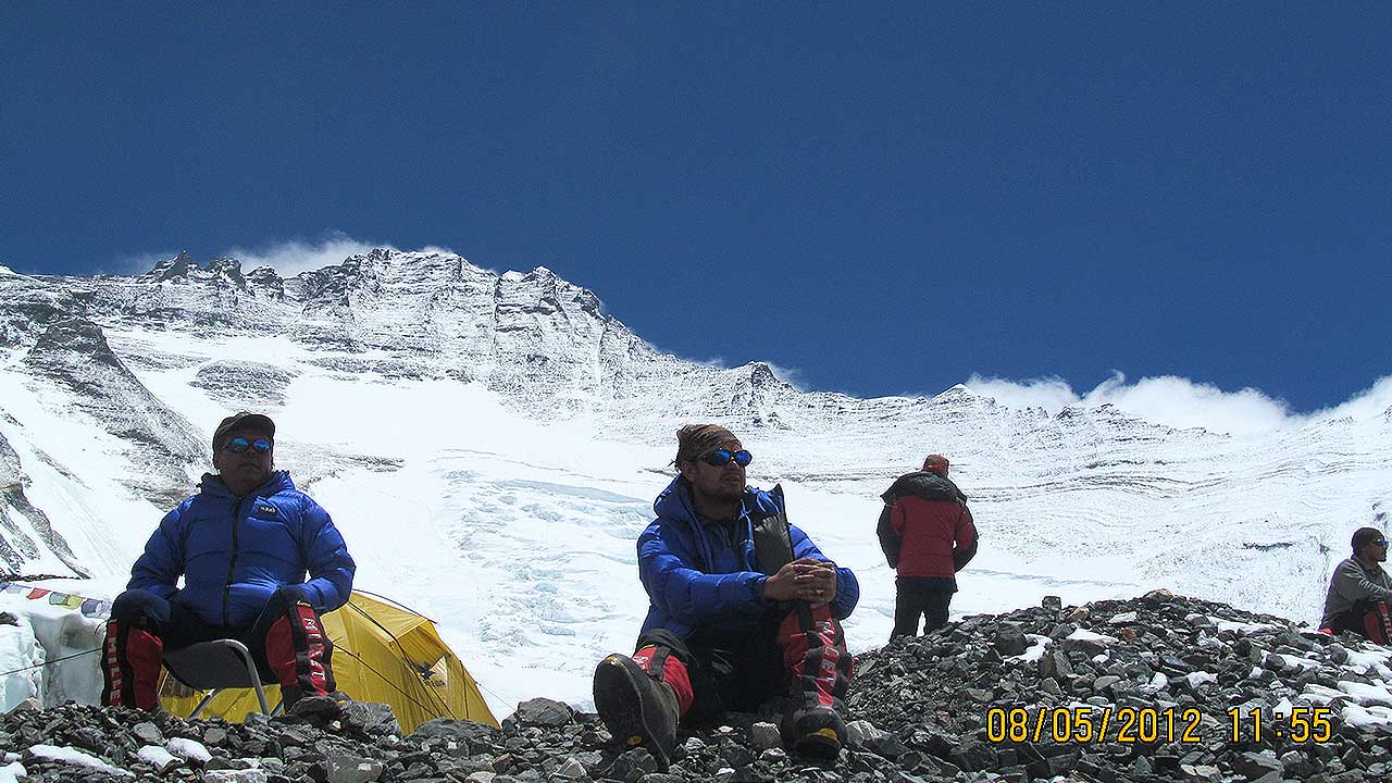 Powell Sharma with Lakpa sherpa camp 2 Everest Mt lhotshe backdrop