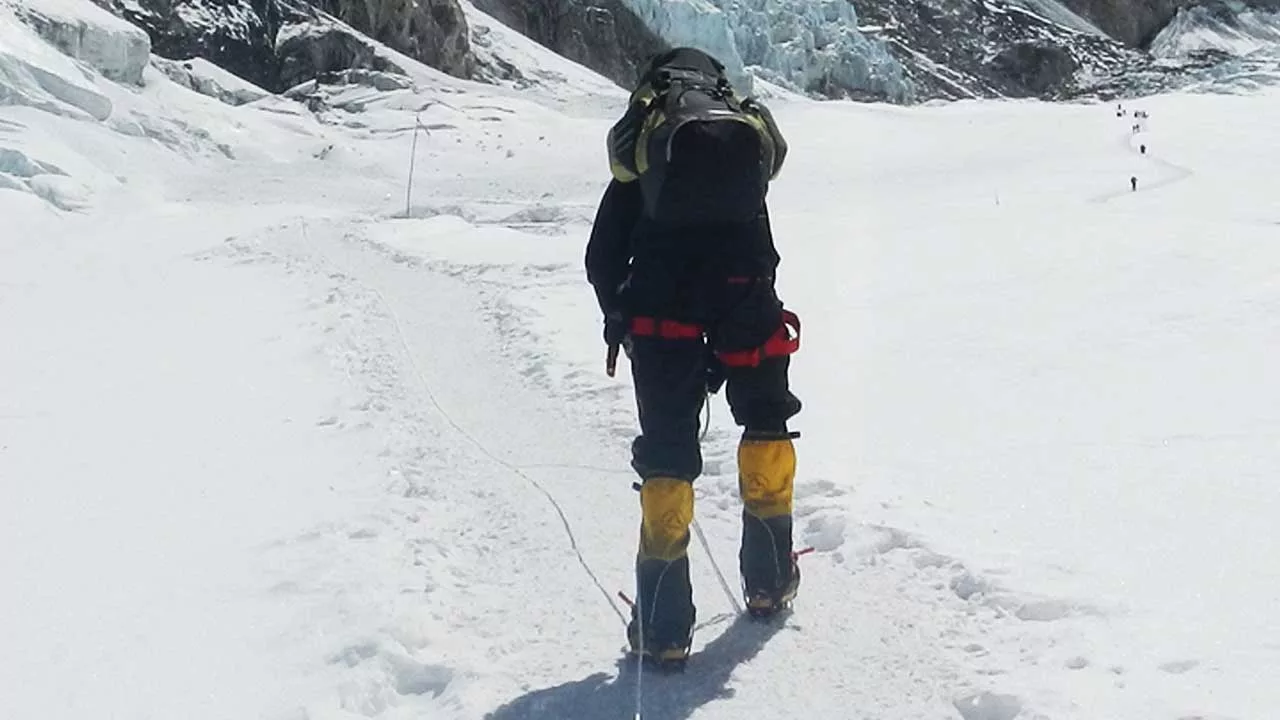 Climber taking breath during the Everest ascent